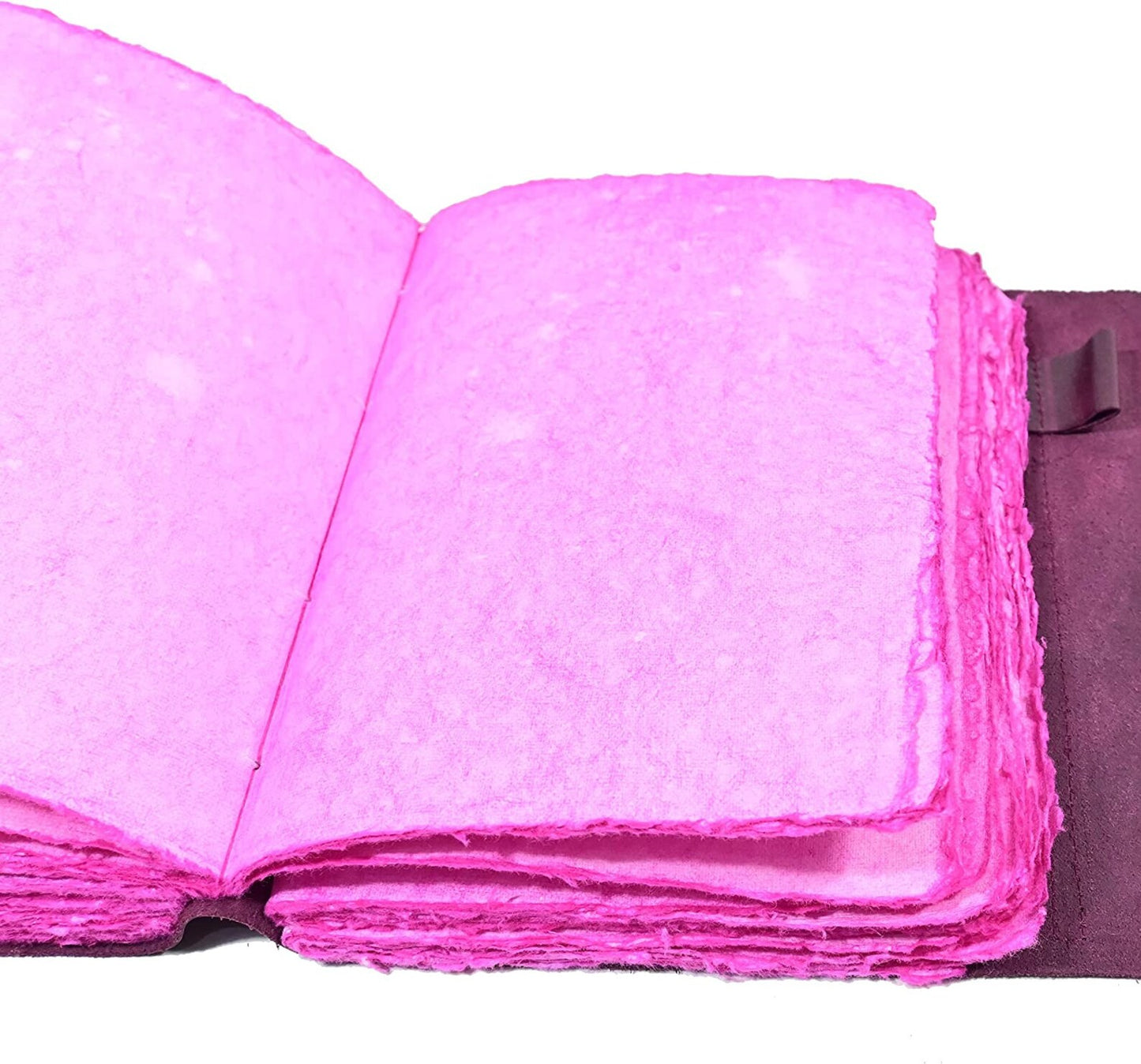 Purple leather journal open showing unlined pages