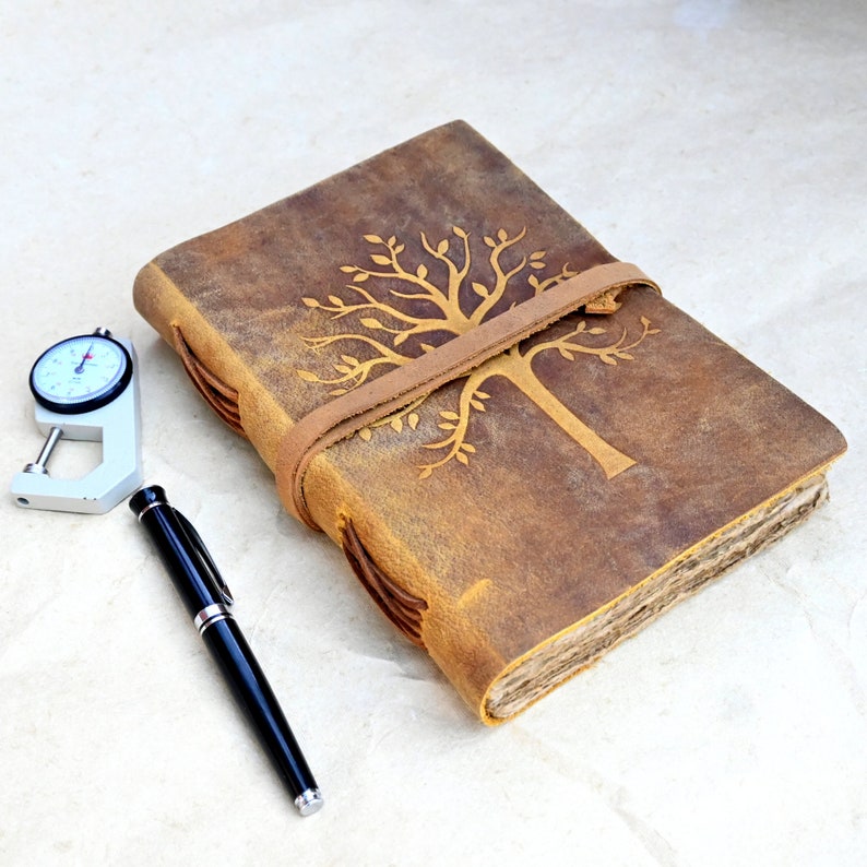 Tree leather journal open showing deckle edge pages