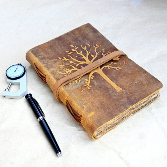 Tree leather journal open showing deckle edge pages