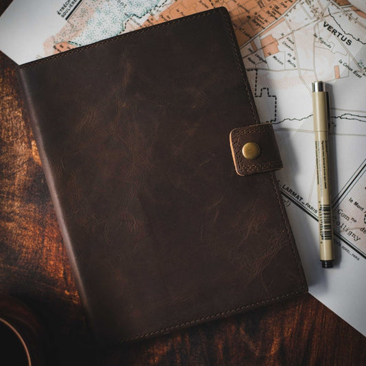 Refillable leather journal open showing lined pages