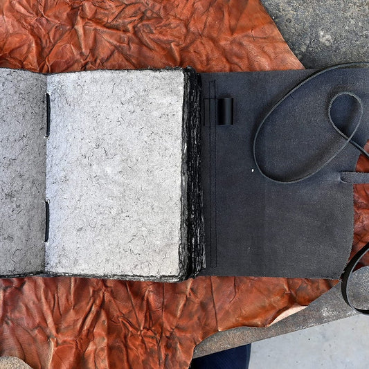 Vintage black leather journal with deckle edge paper