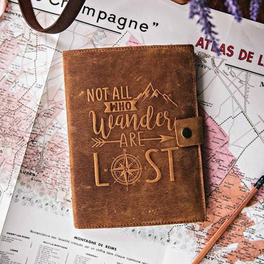 Leather travel journal open showing lined pages