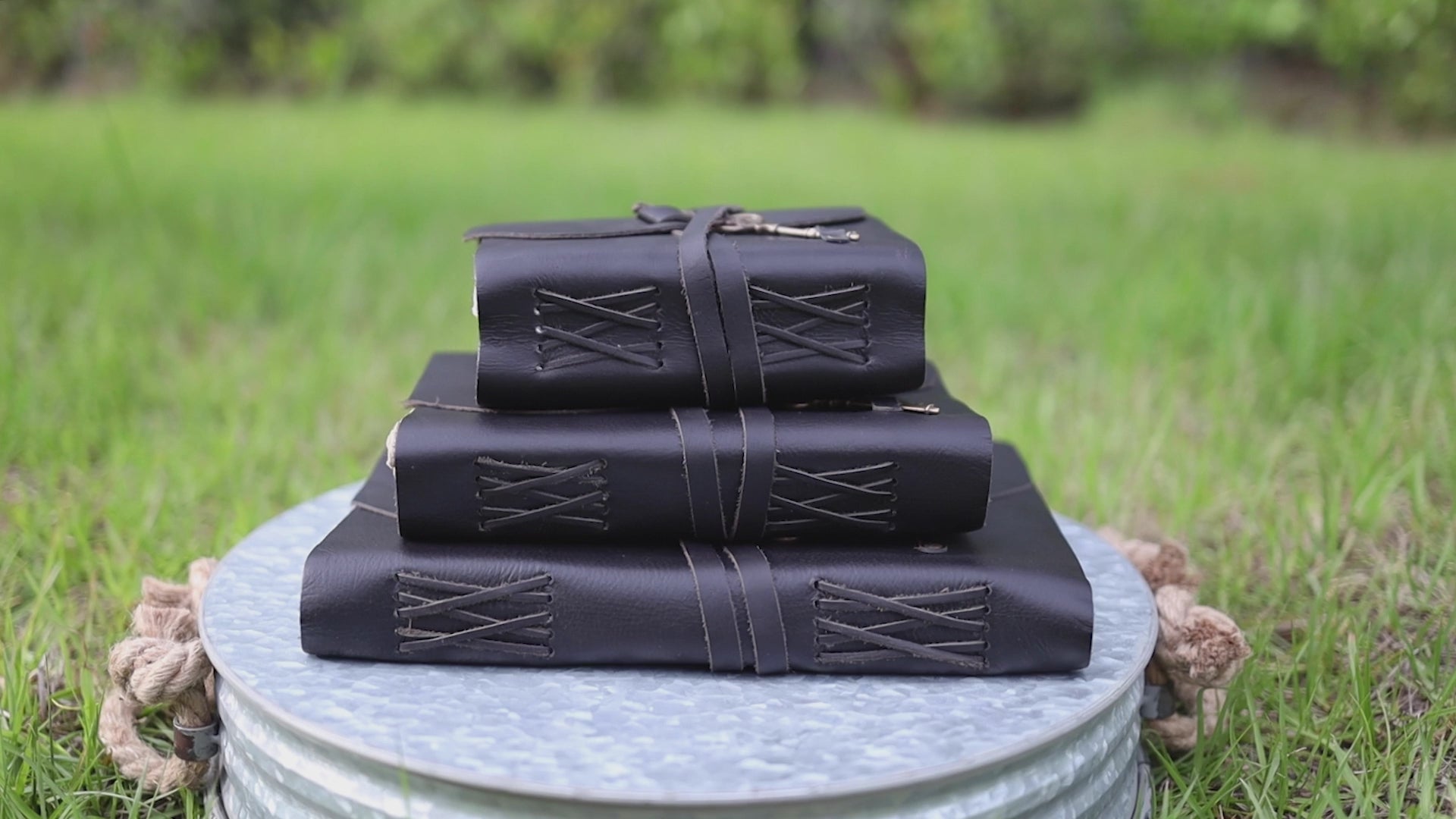 Black leather journal with antique brass key closure and handmade deckle edge pages
