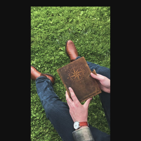 Refillable leather travel journal with embossed compass design cover and lined A5 insert