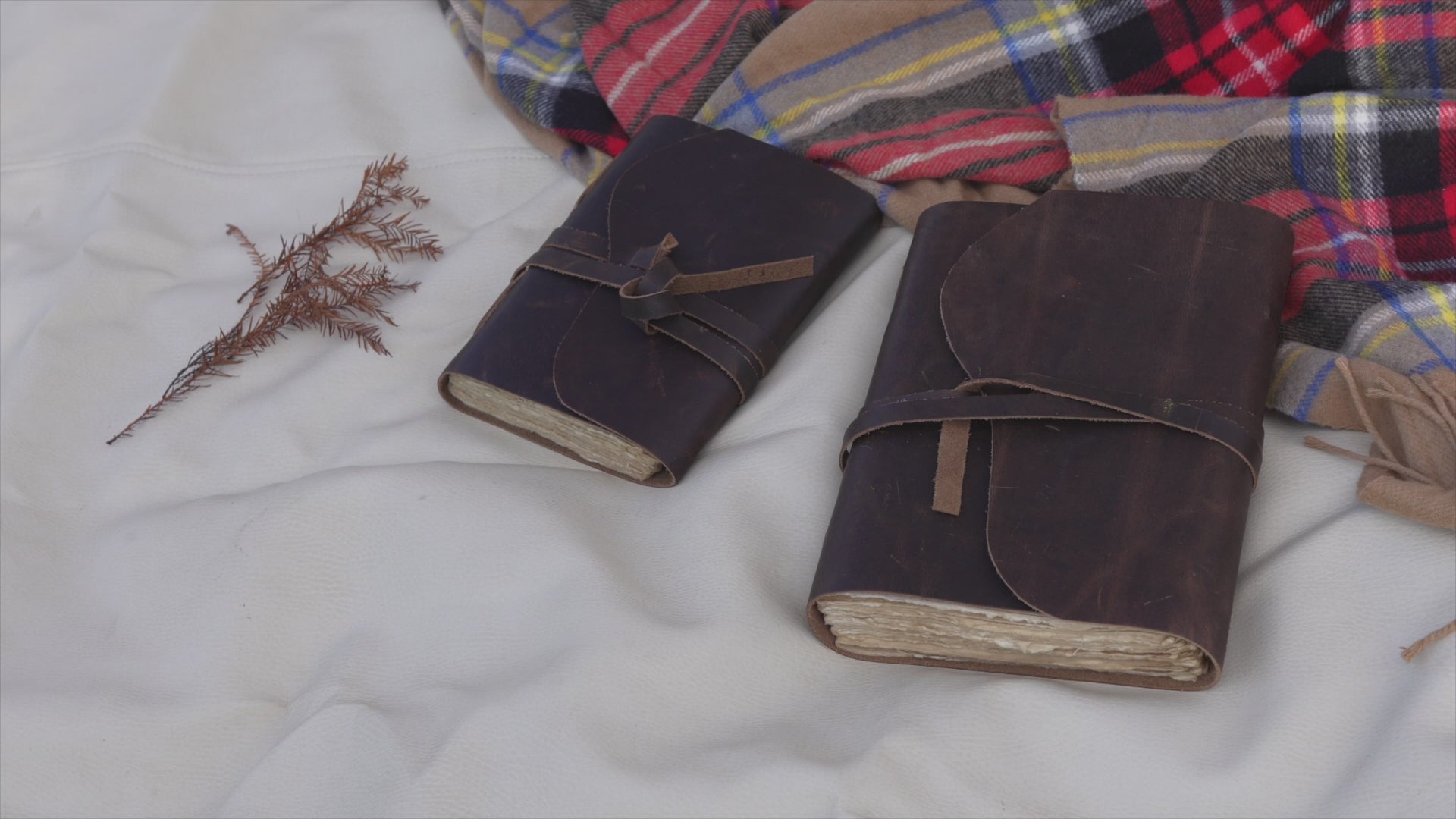 Brown vintage leather journal with lined deckle edge pages — page flip and cover detail