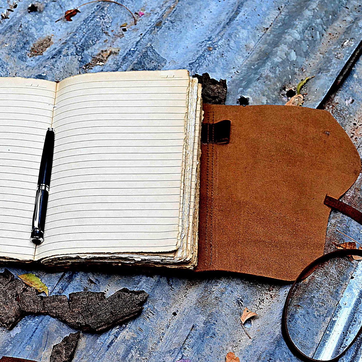Brown leather journal lined pages close-up