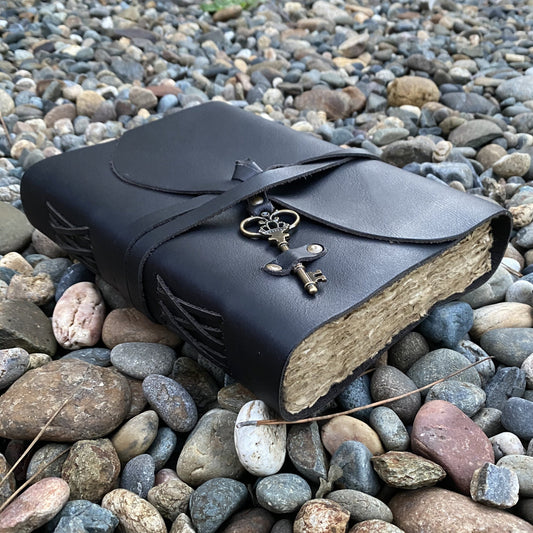 Black leather journal with antique key closure
